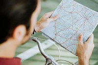 Cyclist checking on a map