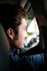 A man driver sitting in a car