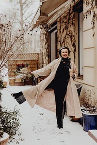 Happy woman holding a bouquet of flowers in the wintertime