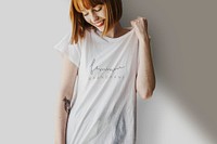 Smiling woman wearing a silk screenwhite t-shirt
