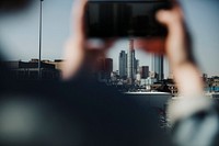 Woman capturing LA town by her phone