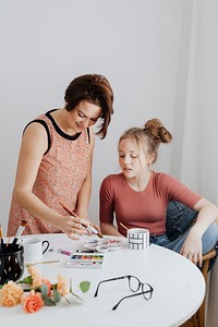 Mother and daughter making art together