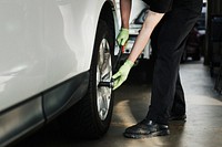 Mechanic fixing the car tires