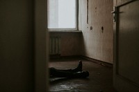 Man lying on the floor of an empty apartmeny