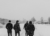 Friends walking in a snowy forest