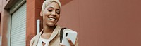 Happy black businesswoman using her smartphone