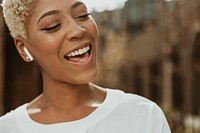 Cheerful black woman listening to music