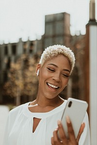 Happy black woman on her phone
