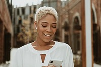 Happy black woman on her phone