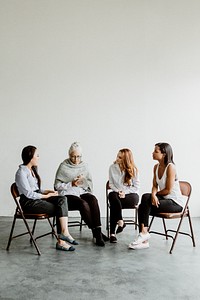 Diverse women in a supporting group session