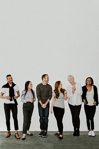 Group of cheerful diverse people talking in a white room