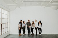 Group of cheerful diverse people talking in a white room
