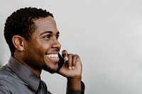Happy black businessman talking on the phone