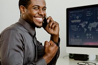 Happy black businessman talking on the phone