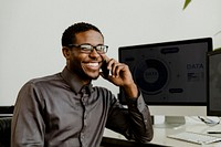 Happy black businessman talking on the phone