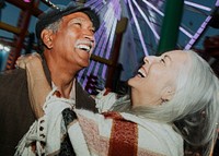 Cheerful elderly couple at Pacific Park in Santa Monica, California