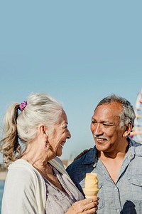 Smiling senior couple having ice cream at Santa Monica Pier