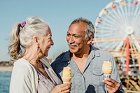 Smiling senior couple having ice cream at Santa Monica Pier