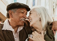 Cheerful senior couple enjoying a Ferris wheel by the Santa Monica pier