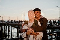 Romantic senior couple by the pier