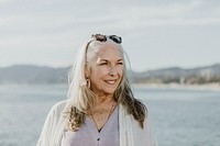 Happy senior woman by the sea