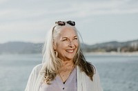 Happy senior woman by the sea