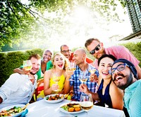Diverse group of friends having a garden party