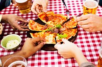 People sharing a pizza on the table