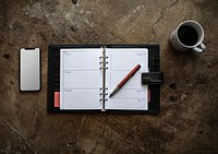 Daily planner and a smartphone screen mockup