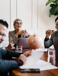 Happy senior woman in a business meeting