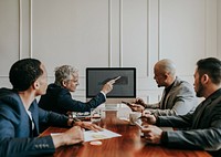 Board of director discussing business growth in computer
