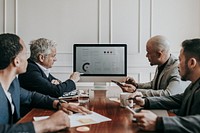 Business people having a conference meeting using a computer