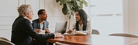 Happy business people talking at a meeting