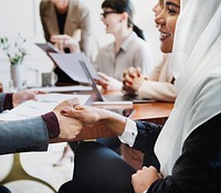 Happy diverse business people making a deal