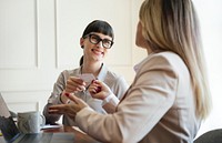 Woman handing a business card in a meeting