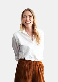 Cheerful stylist standing against a white wall