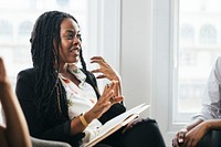 Black female boss talking at a meeting