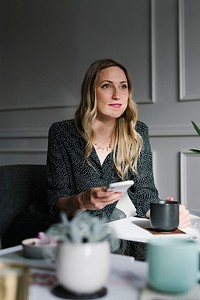 Happy woman using her mobile phone