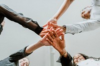 Empowering women stacking their hands