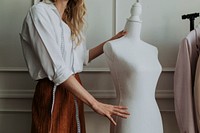 Designer holding a dummy mannequin