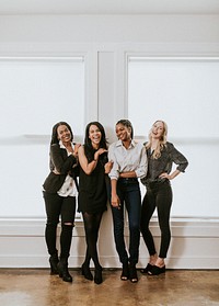 Happy confident businesswomen standing together