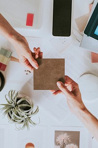 Women handing a blank paper in the office