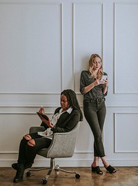 Diverse businesswomen using digital devices