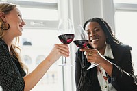Happy businesswomen toasting in the office