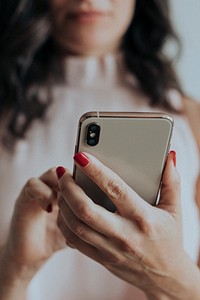 Woman playing on her smartphone