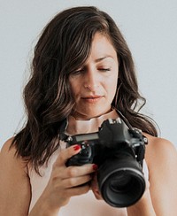 Female photographer holding digital camera