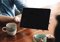 Business people in a meeting using a digital tablet