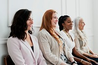 Happy gorgeous women sitting together