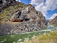 A freight train emerges from a tunnel in the rocks of the Wind River Valley that runs roughly from Shoshoni up to Thermopolis in north-central Wyoming.
