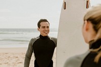 Surfers talking at the beach